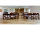 Versatile hall with laminate floors, ample seating, and neutral paint is perfect for hosting events at 10601 42Nd N Ct, Clearwater, FL 33762