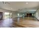 Spacious hall features gleaming laminate floors, bright natural light, and neutral tones for a modern and airy feel at 10601 42Nd N Ct, Clearwater, FL 33762