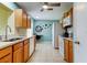 Functional kitchen with tiled floor, wooden cabinets, and modern appliances at 10601 42Nd N Ct, Clearwater, FL 33762
