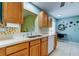 Bright kitchen featuring white countertops, mosaic backsplash, and desk area at 10601 42Nd N Ct, Clearwater, FL 33762