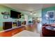 Spacious living area with modern entertainment center and hardwood floors at 10601 42Nd N Ct, Clearwater, FL 33762
