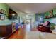 Spacious living room with hardwood floors, sleek furniture, and bright lighting at 10601 42Nd N Ct, Clearwater, FL 33762