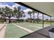 Community shuffleboard courts offer a fun outdoor activity with covered seating and views of the surrounding palm trees at 10601 42Nd N Ct, Clearwater, FL 33762