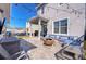 Wide shot of the backyard featuring outdoor seating, a fire pit, and a covered patio at 11309 Grand Park Ave, Riverview, FL 33578