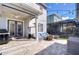 Backyard features a covered patio with seating and grill, plus a fire pit and outdoor living space at 11309 Grand Park Ave, Riverview, FL 33578