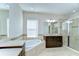 Elegant bathroom featuring a soaking tub, walk-in shower, and double sink vanity at 11309 Grand Park Ave, Riverview, FL 33578