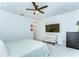 Spacious bedroom with a ceiling fan, lounge chair and bright light at 11309 Grand Park Ave, Riverview, FL 33578