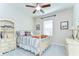 Cozy bedroom with a ceiling fan, bright natural light and carpet at 11309 Grand Park Ave, Riverview, FL 33578