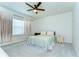 Bright bedroom with a ceiling fan and plush carpeting at 11309 Grand Park Ave, Riverview, FL 33578