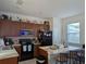 Well-equipped kitchen with modern appliances, ample cabinetry, and a breakfast bar at 11527 Southern Creek Dr, Gibsonton, FL 33534