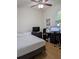 Well-lit bedroom with a ceiling fan and desk at 11527 Southern Creek Dr, Gibsonton, FL 33534