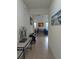 Interior hallway view showcasing art, decor, and an open floor plan flowing into the living space at 11527 Southern Creek Dr, Gibsonton, FL 33534