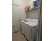 Well-lit laundry room featuring a white washer and dryer at 11527 Southern Creek Dr, Gibsonton, FL 33534