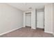 This bedroom has neutral walls, a closet and neutral color carpet at 12310 Streambed Dr, Riverview, FL 33579