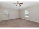 Comfortable bedroom with neutral tones, a ceiling fan, and plenty of natural light at 12310 Streambed Dr, Riverview, FL 33579