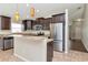 Open kitchen design with stainless steel appliances and modern finishes at 12310 Streambed Dr, Riverview, FL 33579
