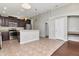 Open kitchen with stainless steel appliances, stylish cabinetry and tile flooring at 12310 Streambed Dr, Riverview, FL 33579