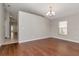 Open living room with hardwood floors and neutral paint for the perfect canvas at 12310 Streambed Dr, Riverview, FL 33579