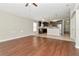 Spacious living room with wood floors that flows into an open kitchen area at 12310 Streambed Dr, Riverview, FL 33579