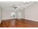 Bright living room featuring hardwood floors, neutral wall paint and plenty of natural light at 12310 Streambed Dr, Riverview, FL 33579