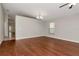 Spacious living room with hardwood floors, natural light, and an elegant chandelier at 12310 Streambed Dr, Riverview, FL 33579
