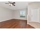 Bright living room featuring beautiful hardwood floors and neutral wall paint at 12310 Streambed Dr, Riverview, FL 33579
