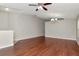 Spacious living room featuring hardwood floors and neutral paint ready for decor at 12310 Streambed Dr, Riverview, FL 33579