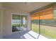 This patio is screened in and has a sliding glass door at 12310 Streambed Dr, Riverview, FL 33579