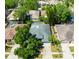 Aerial view of home showcasing roof, screened pool, and placement on the lot at 12920 Lake Ventana Dr, Tampa, FL 33625