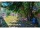 Backyard featuring mature trees for shade and a fully fenced yard at 12920 Lake Ventana Dr, Tampa, FL 33625