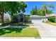 Charming single-story home with a well-manicured lawn and mature trees at 12920 Lake Ventana Dr, Tampa, FL 33625