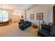 Comfortable living room featuring neutral walls, carpet, and seating at 12920 Lake Ventana Dr, Tampa, FL 33625