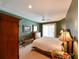 Bright and airy main bedroom featuring plush carpeting, natural light, and elegant furnishings at 12920 Lake Ventana Dr, Tampa, FL 33625