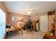 Home office featuring natural light, a ceiling fan, ample desk space, and convenient closet storage at 12920 Lake Ventana Dr, Tampa, FL 33625