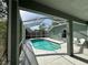 Screened-in pool featuring a spacious deck area for entertaining or relaxing in a private outdoor setting at 12920 Lake Ventana Dr, Tampa, FL 33625