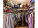 Organized walk-in closet with shelving, hanging racks, and ample storage space for clothes and accessories at 12920 Lake Ventana Dr, Tampa, FL 33625