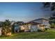 A backyard featuring a screened-in pool and outdoor seating area at 13008 Eagles Entry Dr, Odessa, FL 33556