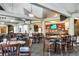 Spacious bar area featuring ample seating, a fully stocked bar, and multiple televisions for entertainment at 13008 Eagles Entry Dr, Odessa, FL 33556