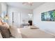 Bedroom suite featuring neutral tones, large windows, and en-suite bathroom at 13008 Eagles Entry Dr, Odessa, FL 33556