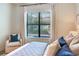Bedroom featuring a large window view of the backyard pool area at 13008 Eagles Entry Dr, Odessa, FL 33556
