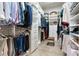 A walk-in closet features custom shelving, drawers, and ample storage space at 13008 Eagles Entry Dr, Odessa, FL 33556