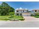 Charming two-story home with manicured lawn and three car garage at 13008 Eagles Entry Dr, Odessa, FL 33556