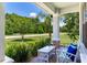 Relaxing front porch view with comfortable seating and lush landscaping at 13008 Eagles Entry Dr, Odessa, FL 33556