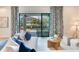 Comfortable living room with a view of the patio and pool through sliding glass doors at 13008 Eagles Entry Dr, Odessa, FL 33556