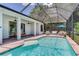 The fully screened pool area offers a great space for relaxation and recreation at 13008 Eagles Entry Dr, Odessa, FL 33556