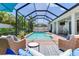 The expansive screened-in pool area is ideal for both lounging and entertaining guests at 13008 Eagles Entry Dr, Odessa, FL 33556