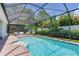 Enjoy this screened-in pool and patio area offering comfortable seating and privacy at 13008 Eagles Entry Dr, Odessa, FL 33556