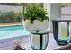 Stylish poolside decor creates a relaxing and inviting outdoor atmosphere at 13008 Eagles Entry Dr, Odessa, FL 33556
