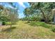 Expansive backyard with a small fire pit, and ample room for gardening and outdoor activities at 1308 W Perdiz St, Tampa, FL 33612