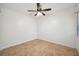 Neutral bedroom with neutral tile flooring, ceiling fan, and great natural light at 1308 W Perdiz St, Tampa, FL 33612